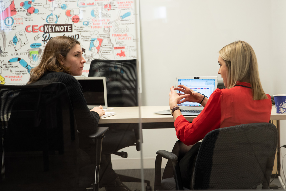 Women talking in office